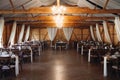 Cheerful wedding reception taking place in a rustic barn setting. Royalty Free Stock Photo
