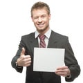 Cheerful winking businessman holding sign Royalty Free Stock Photo