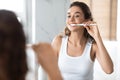 Cheerful Woman Brushing Teeth And Doing Toothcare Routine In Bathroom Royalty Free Stock Photo