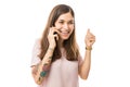 Cheerful Woman Clenching Fist While Talking On Mobile Phone