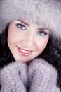 Cheerful woman clothing in warm hat.