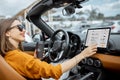 Woman controlling car with a digital dashboard Royalty Free Stock Photo