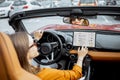 Woman controlling car with a digital dashboard Royalty Free Stock Photo