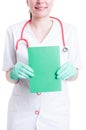 Cheerful woman doctor holding a blank green cardboard Royalty Free Stock Photo