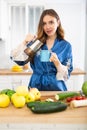 Cheerful woman drinking coffee in apartment Royalty Free Stock Photo