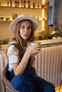 Cheerful woman drinking coffee communication morning rest.