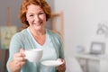 Cheerful woman drinking tea Royalty Free Stock Photo