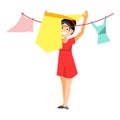 Cheerful woman drying clothes