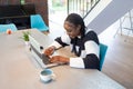 Cheerful Woman Enjoying Remote Work in a Bright Home Setting Royalty Free Stock Photo