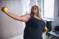 Cheerful woman enjoying working out at home