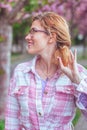 Cheerful woman in eyeglasses looking away in park Royalty Free Stock Photo