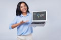 Cheerful woman giving presentation and pointing at laptop