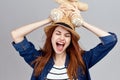 cheerful woman in a hat with a teddy bear gift toy Royalty Free Stock Photo
