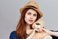 cheerful woman in a hat with a teddy bear gift toy Royalty Free Stock Photo