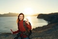 cheerful woman hiker rocky mountains landscape sunset fresh air