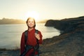 cheerful woman hiker rocky mountains landscape sunset fresh air
