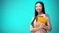 Cheerful woman holding British flag book, education abroad, learning language Royalty Free Stock Photo