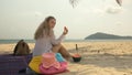 The cheerful woman in holding and eating slices of watermelon on tropical sand beach sea. Portrait attractive girl spend Royalty Free Stock Photo