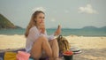 The cheerful woman in holding and eating slices of watermelon on tropical sand beach sea. Portrait attractive girl spend Royalty Free Stock Photo