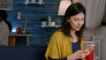 Cheerful woman holding phone in hand browsing on internet Royalty Free Stock Photo