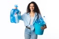 Cheerful Woman Holding Plastic Garbage Bag And Bucket, White Background