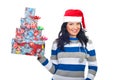 Cheerful woman holding stack of Christmas gifts Royalty Free Stock Photo