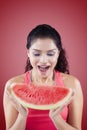 Cheerful woman holds a slice of watermelon Royalty Free Stock Photo