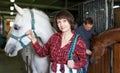 Cheerful woman horse farm worker Royalty Free Stock Photo