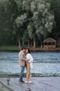 Cheerful woman hugging boyfriend in cardigan Royalty Free Stock Photo