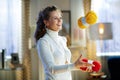 Cheerful woman juggles with yellow and red yarn Royalty Free Stock Photo