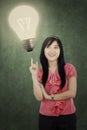 Cheerful woman and lightbulb Royalty Free Stock Photo