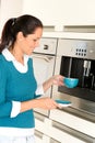 Cheerful woman making coffee machine kitchen cup Royalty Free Stock Photo