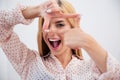 Cheerful woman making a hand frame Royalty Free Stock Photo