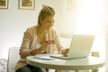 Cheerful woman paying bills. Royalty Free Stock Photo