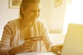 Cheerful woman paying bills. Royalty Free Stock Photo