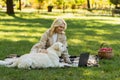 cheerful woman petting labrador dog while Royalty Free Stock Photo