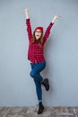 Cheerful woman posing with raised hands up Royalty Free Stock Photo