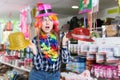 Cheerful woman choosing funny headdresses Royalty Free Stock Photo