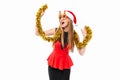 Cheerful woman in santa hat and christmas glasses celebrating ne