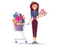 Cheerful Woman with Shopping Trolley Full of Gifts