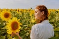 Cheerful woman in a sunflower field landscape nature sun agriculture Royalty Free Stock Photo