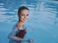 cheerful woman in swimsuit in swimming pool clean water leisure lifestyle Royalty Free Stock Photo