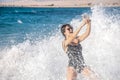 Cheerful woman in a swimsuit takes a selfie by the sea Royalty Free Stock Photo