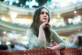 Cheerful woman theatre goer looking at play Royalty Free Stock Photo