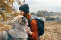 cheerful woman tourist playing dog nature landscape friendship