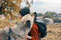 cheerful woman tourist playing dog nature landscape friendship