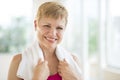 Cheerful Woman With Towel Around Neck Royalty Free Stock Photo