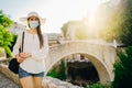 Cheerful woman travelling to Europe amid COVID-19. Visiting local tourist destinations, Old Bridge in Mostar, Bosnia and