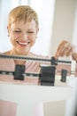 Cheerful Woman Using Balance Weight Scale Royalty Free Stock Photo