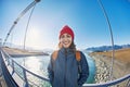 Cheerful woman walks on the brige in Jokulsarlon Ice Lagoon Royalty Free Stock Photo